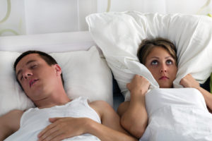 Snoring sleep apnea symptom